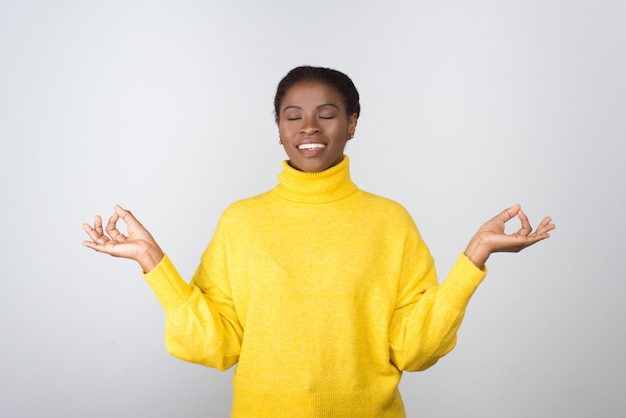 Relaxed happy young woman with closed eyes