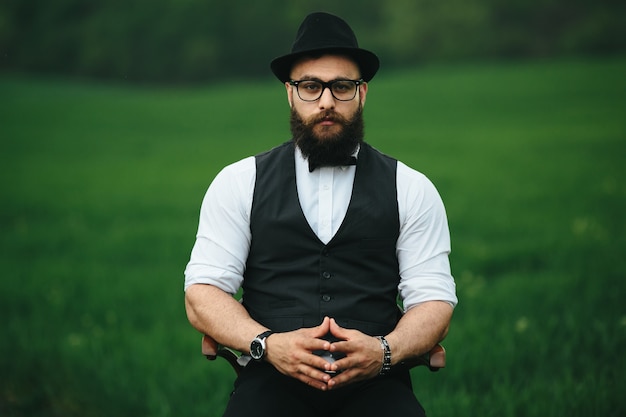 Relaxed man posing in the field