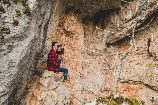 Relaxed man with his binoculars