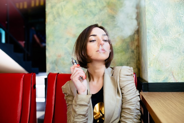 Free photo relaxed woman smoking