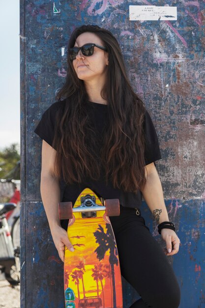 Relaxed woman with longboard