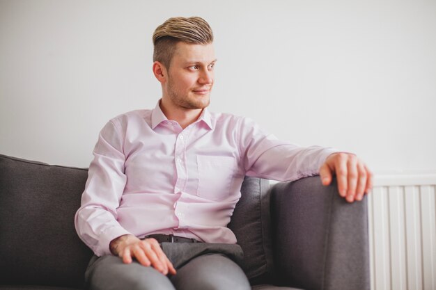 Relaxed young man looking to the side