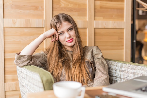 Relaxed young woman in a coffee shop