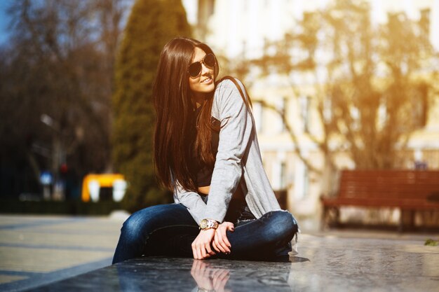 Relaxed young woman in the square