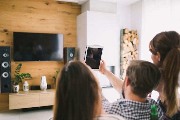 Relaxing people taking selfie with tablet