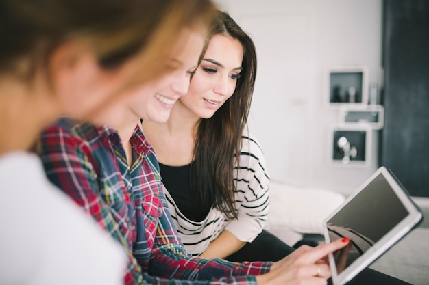 Relaxing women using tablet together