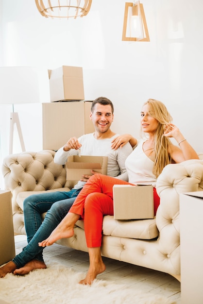 Relocating couple on sofa