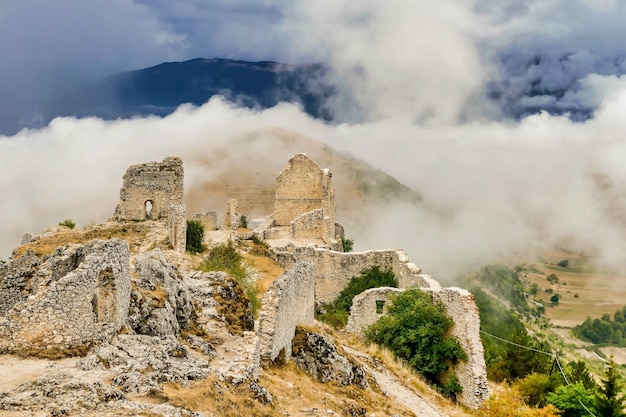 Remains of a building surrounded by the mist descended from the mountains