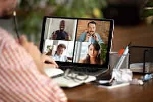 Free photo remote meeting. man working from home during coronavirus or covid-19 quarantine, remote office concept.