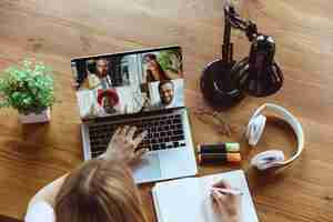 Free photo remote meeting. woman working from home during coronavirus or covid-19 quarantine, remote office concept.