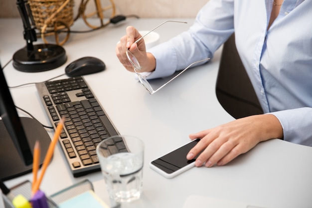 Remote working from home. Workplace in home office with PC, devices and gadgets.