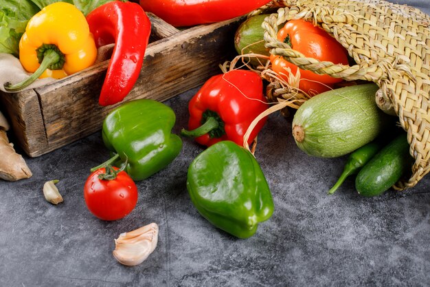 Removing mixed vegetables out of a rustic basket.