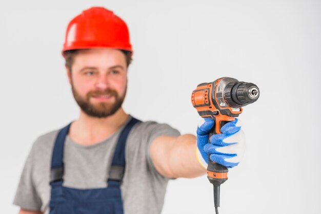 Repairman holding drill in hand 