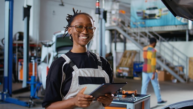 Free photo repairman showing customer car changes