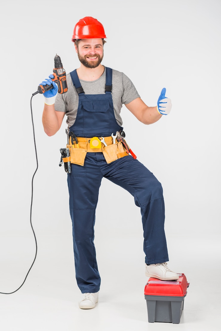 Free Photo repairman with drill showing thumb up