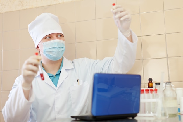 Free photo research worker with test tubes