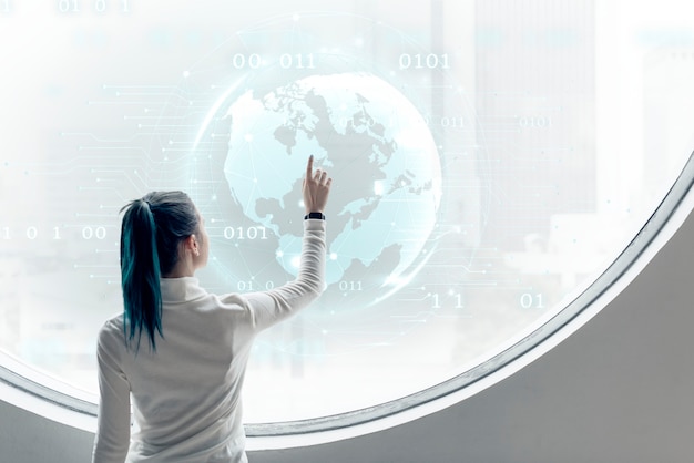 Researcher spinning a globe on a round screen