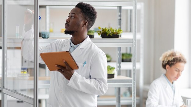 Researcher with tablet in the biotechnology laboratory