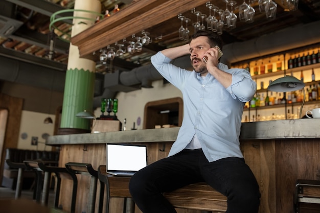 Restaurant, cafe, bar closed due to COVID-19 or Coronavirus outbreak lockdown, stressed owner of small business, depression. Businessman exhausted, upset. Business, economy, finance crisis.