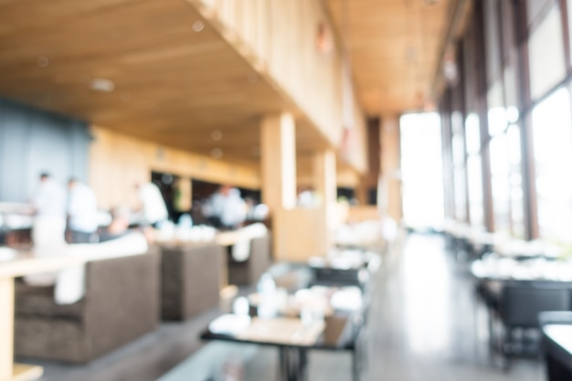 Restaurant unfocused with black tables