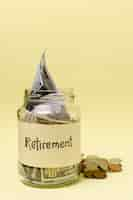 Free photo retirement label on a jar filled with money front view