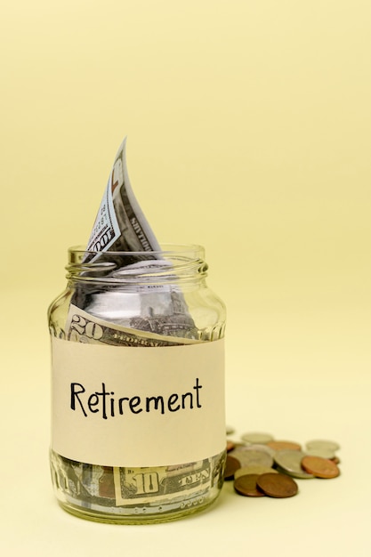 Retirement label on a jar filled with money front view