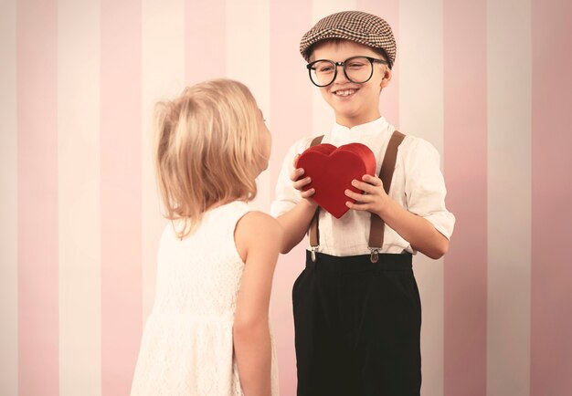 Free photo retro boy giving heart for his love