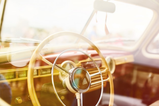 Free photo retro car parked on grass