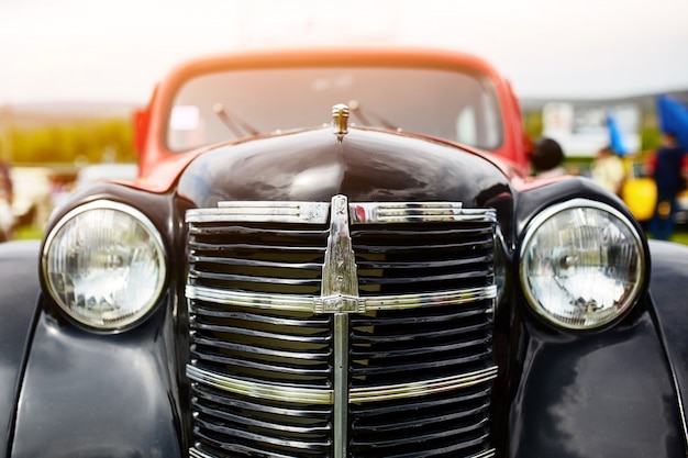 Retro car parked on grass