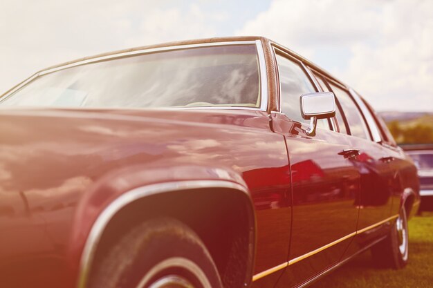 Retro car parked on grass