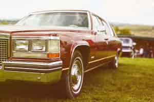 Free photo retro car parked on grass