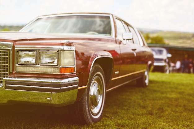 Retro car parked on grass