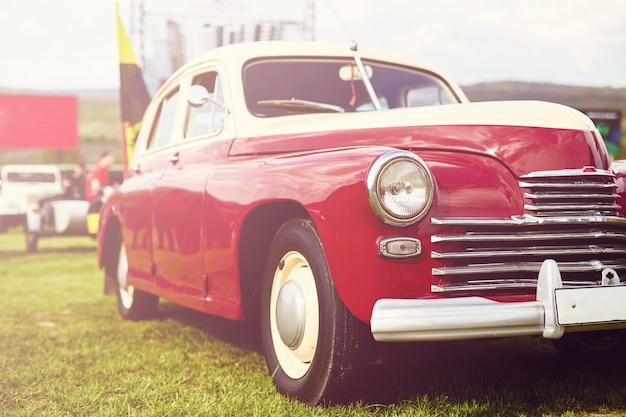 Retro car parked on grass