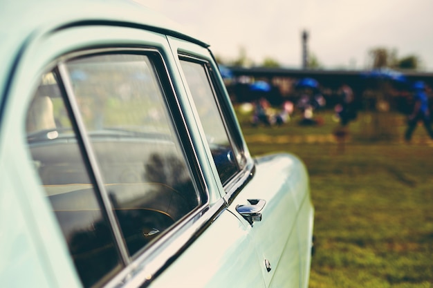 Retro car parked on grass