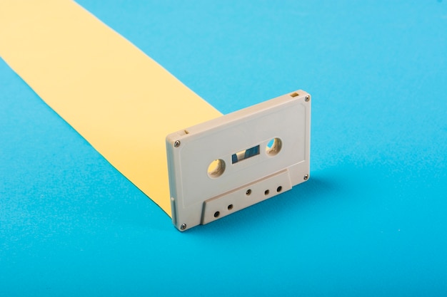 Retro cassette tape on blue background