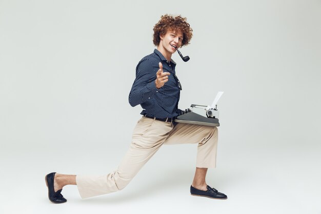 Retro man dressed in shirt sitting and posing