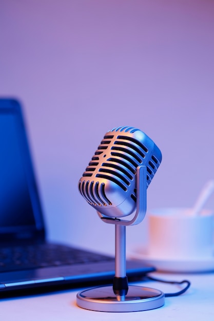 Retro microphone and notebook computer, live webcast on air concept