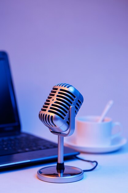 Retro microphone and notebook computer, live webcast on air concept