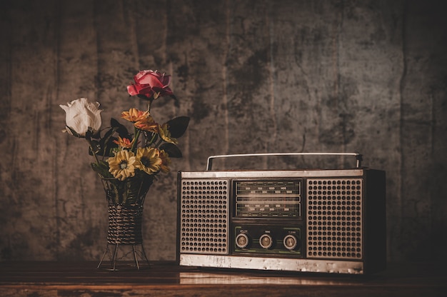 retro radio receiver and flower vases