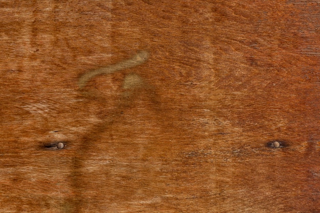 Free photo retro wood surface with rusted nails