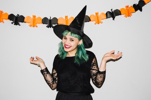 Рretty witch smiling at camera