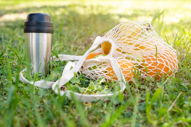 Reusable bag and termon on grass