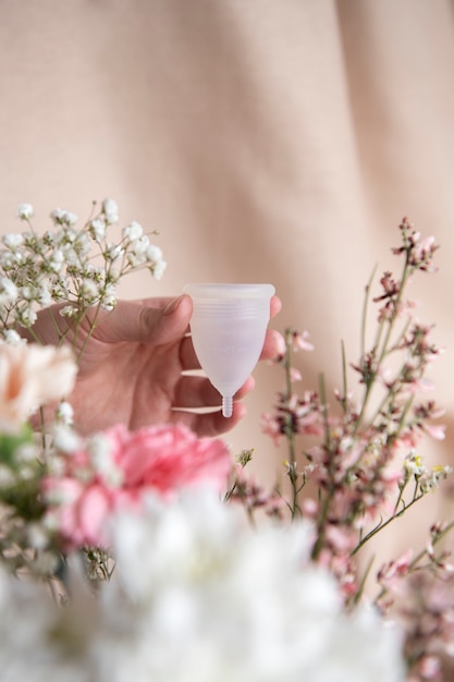 Reusable menstrual cup product with flowers