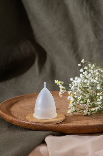 Reusable menstrual cup product with flowers