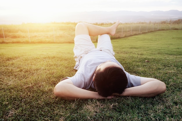 Rexation man on green grass.