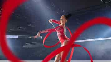 Free photo rhythmic gymnast in professional arena