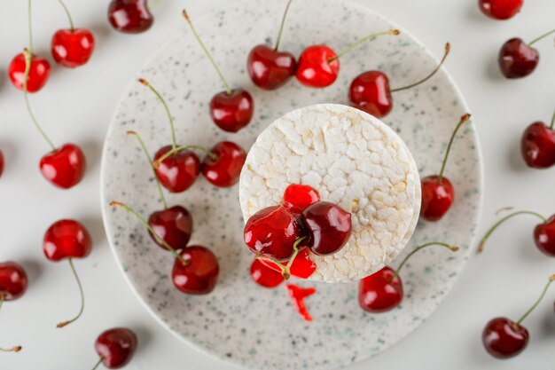 Rice cakes in a plate with cherries, jelly