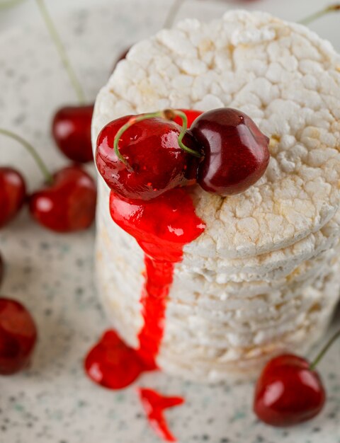 Rice cakes in a plate with cherries