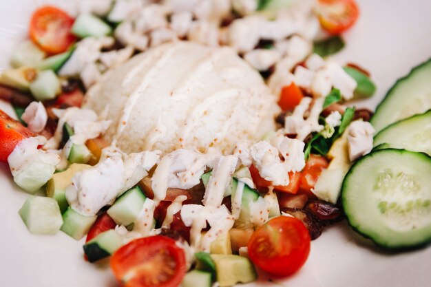 Rice dish with tomatoes and cucumber