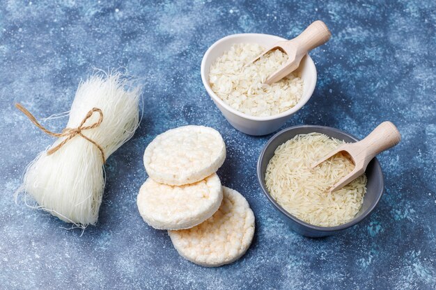 Rice flakes, rice noodles, rice bread and rice, top view